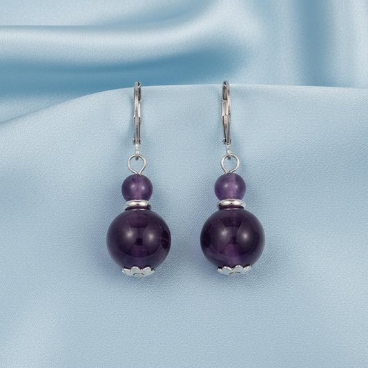 Amethyst double bead earrings on light blue satin