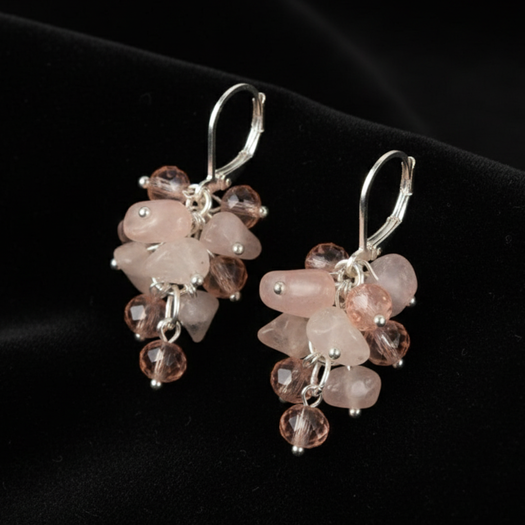 Rose quartz earrings on black velvet