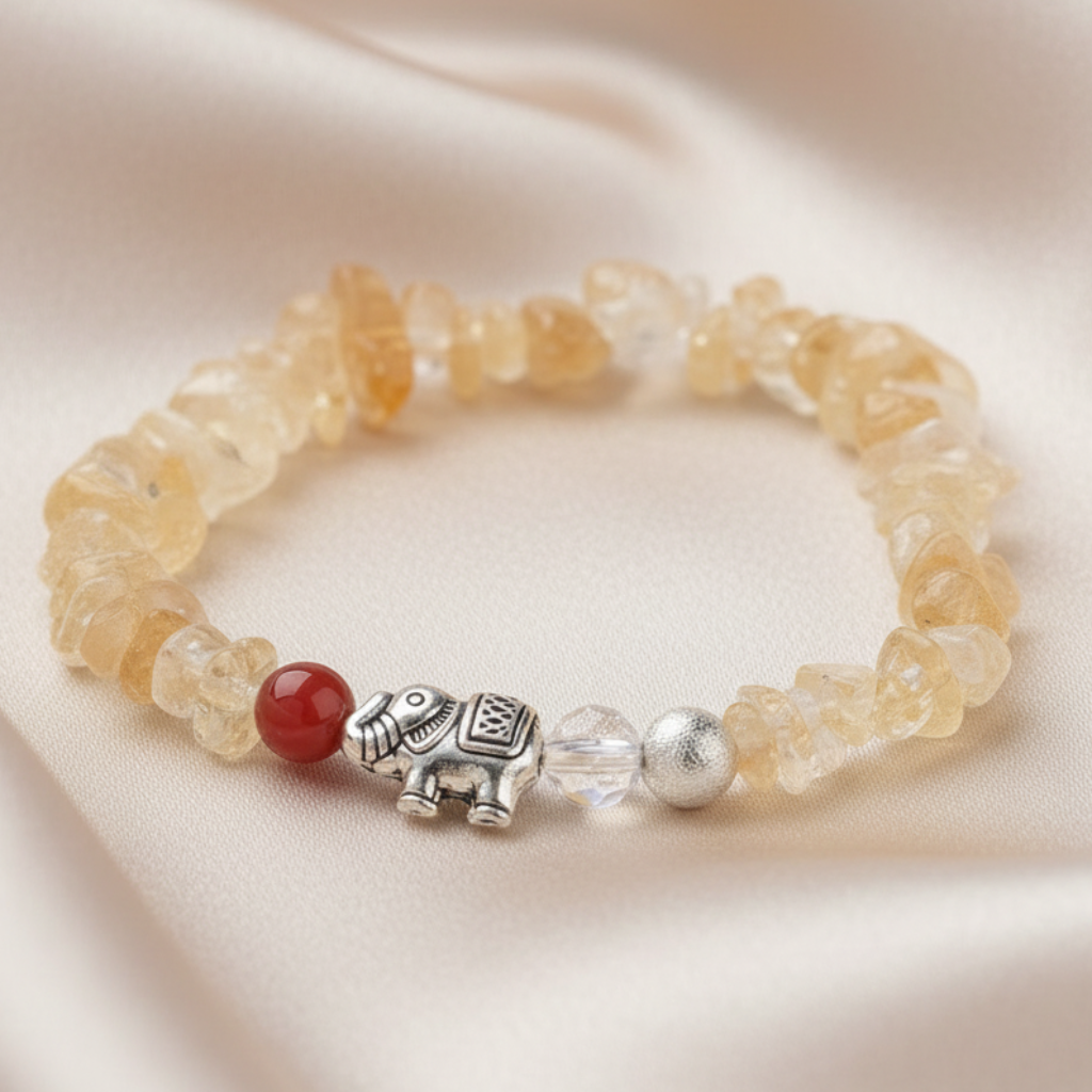 Citrine chip bracelet with silver elephant charm