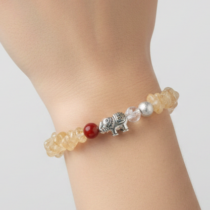 Citrine bracelet on model hand with minimalist background