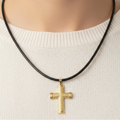 Female torso wearing gold cross necklace