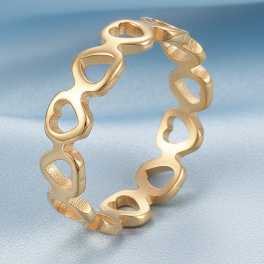 Gold Heart Ring – Light Blue Satin Background