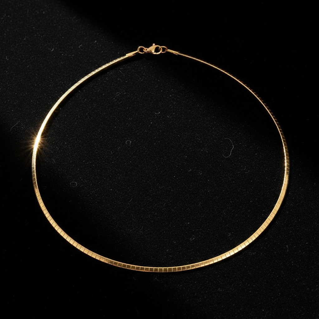 Gold omega chain on black velvet