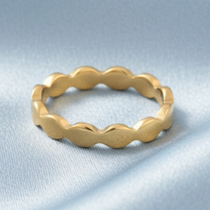 Gold Wavy Ring – Satin Light Blue Background