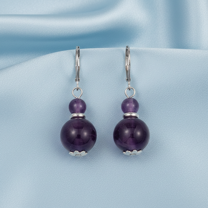 Amethyst double bead earrings on light blue satin