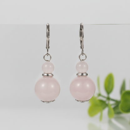 Rose quartz double bead earrings on nature background