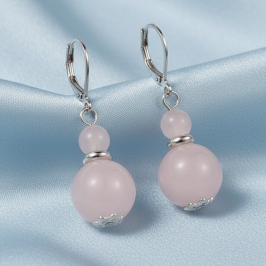 Rose quartz double bead earrings on light blue satin
