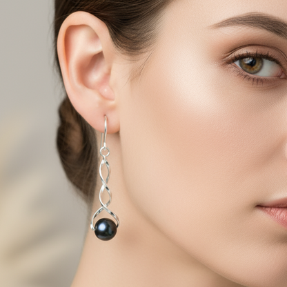 Model wearing black pearl earrings