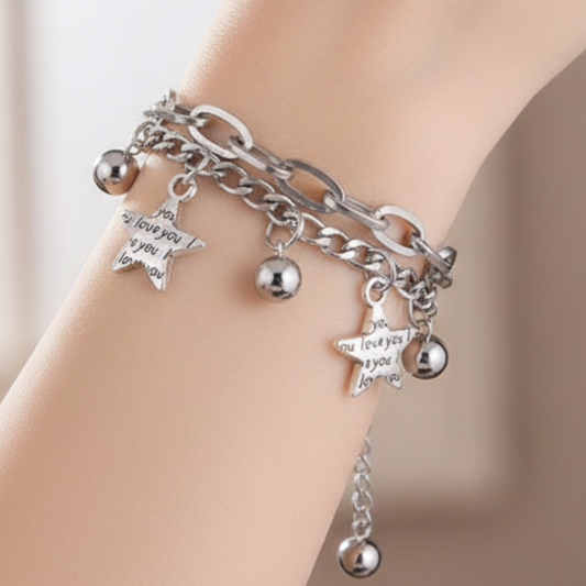 Model wearing layered chain bracelet
