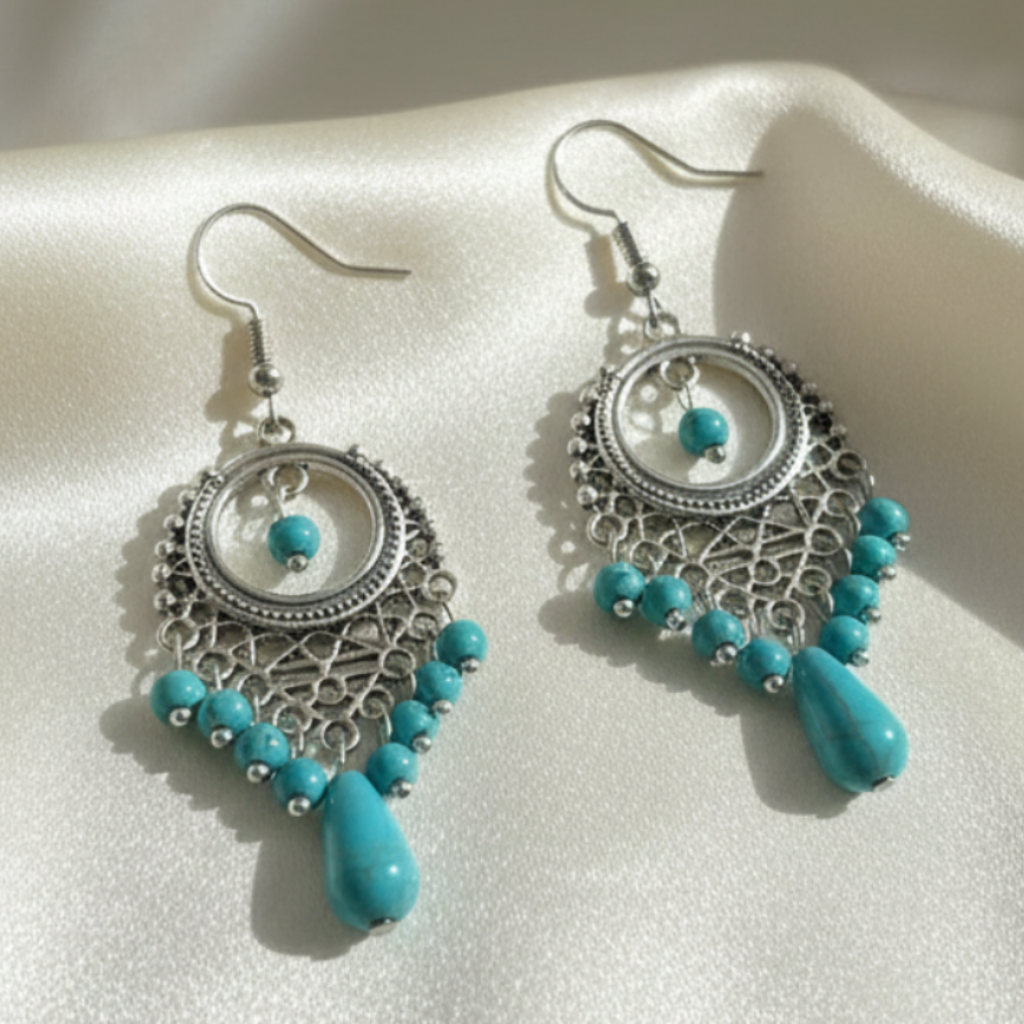 Pair of Turquoise Earrings on Cream Satin