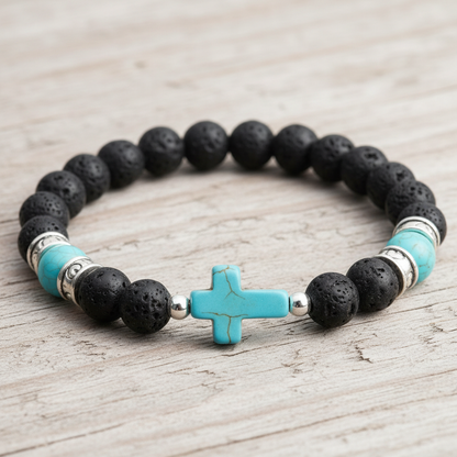 Pulsera lava con cruz turquesa sobre madera